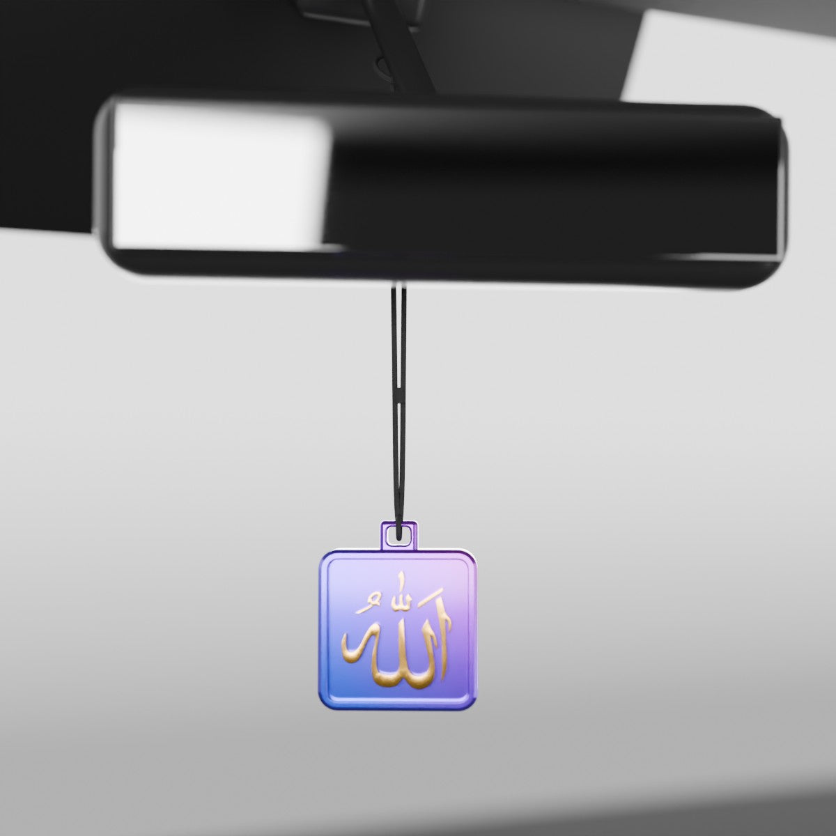 The Allah collectible hanging from a car's rear-view mirror on a cord