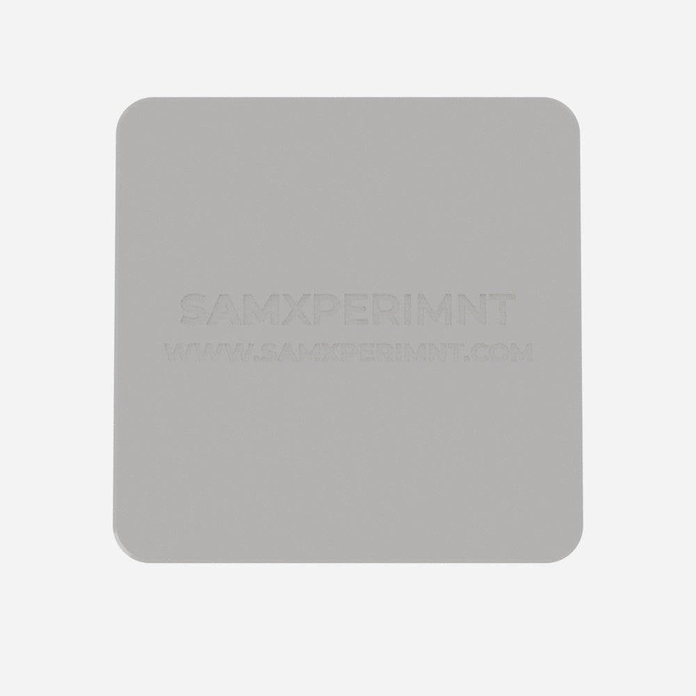 Underside of the Ganesha base with the samxperimnt logo and website debossed